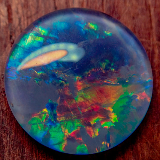 AAA + Black Opal Triplet, Australien, 0,681g - 3.405ct