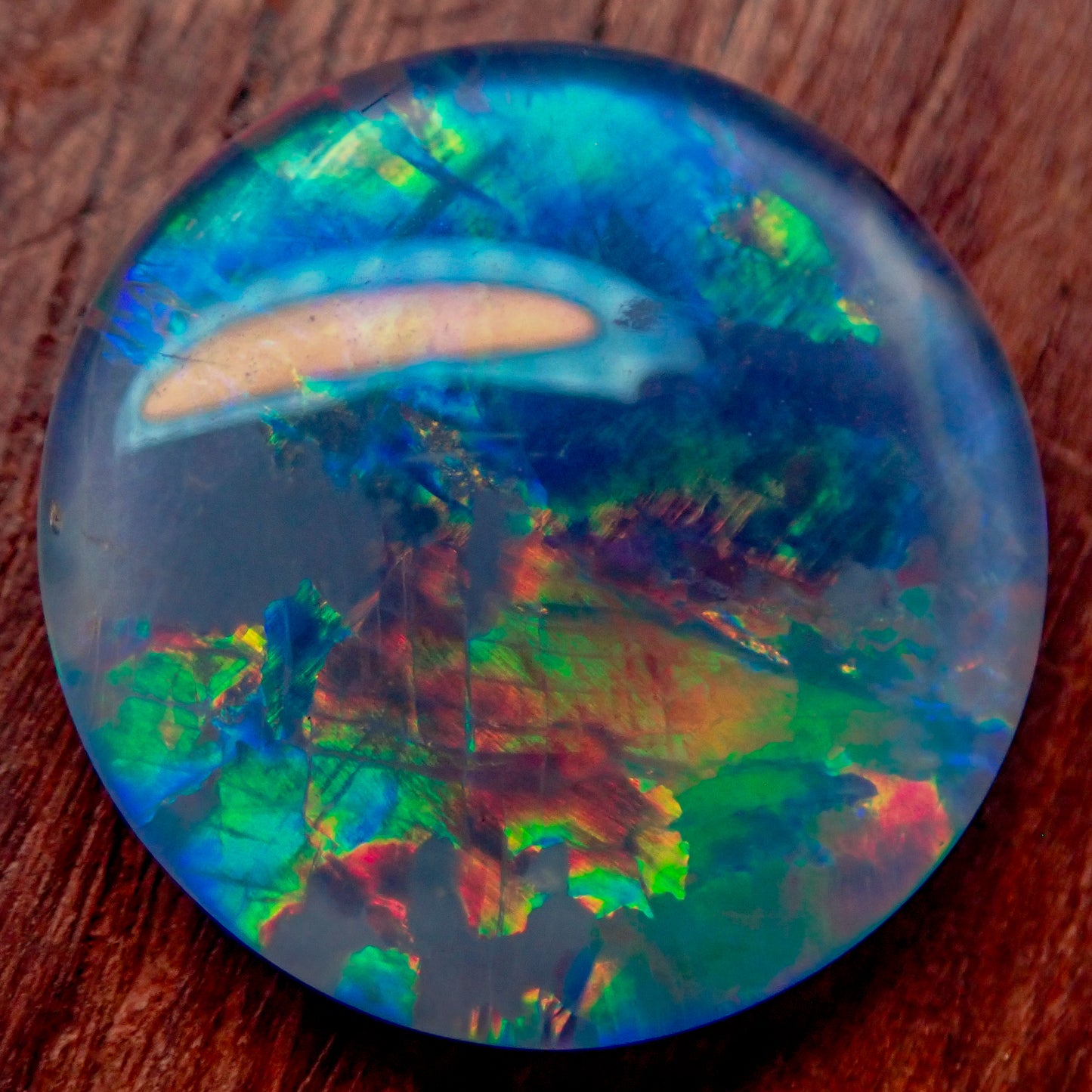 AAA + Black Opal Triplet, Australien, 0,681g - 3.405ct