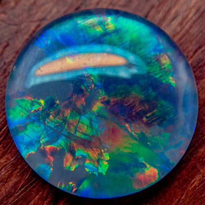 AAA + Black Opal Triplet, Australien, 0,681g - 3.405ct