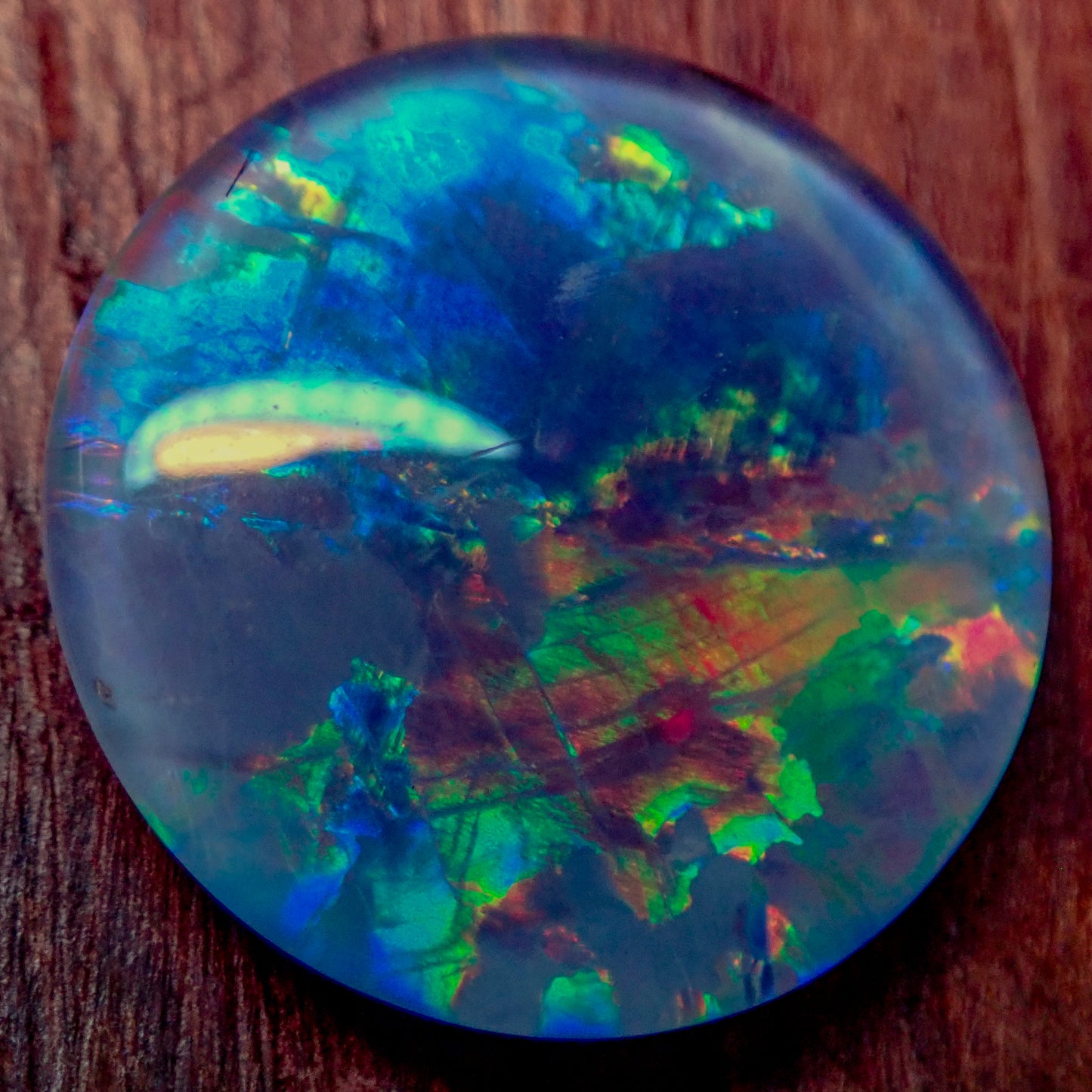 AAA + Black Opal Triplet, Australien, 0,681g - 3.405ct