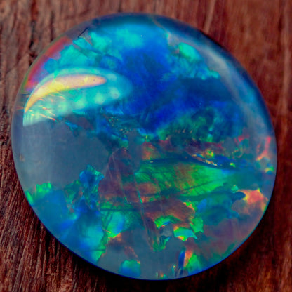 AAA + Black Opal Triplet, Australien, 0,681g - 3.405ct