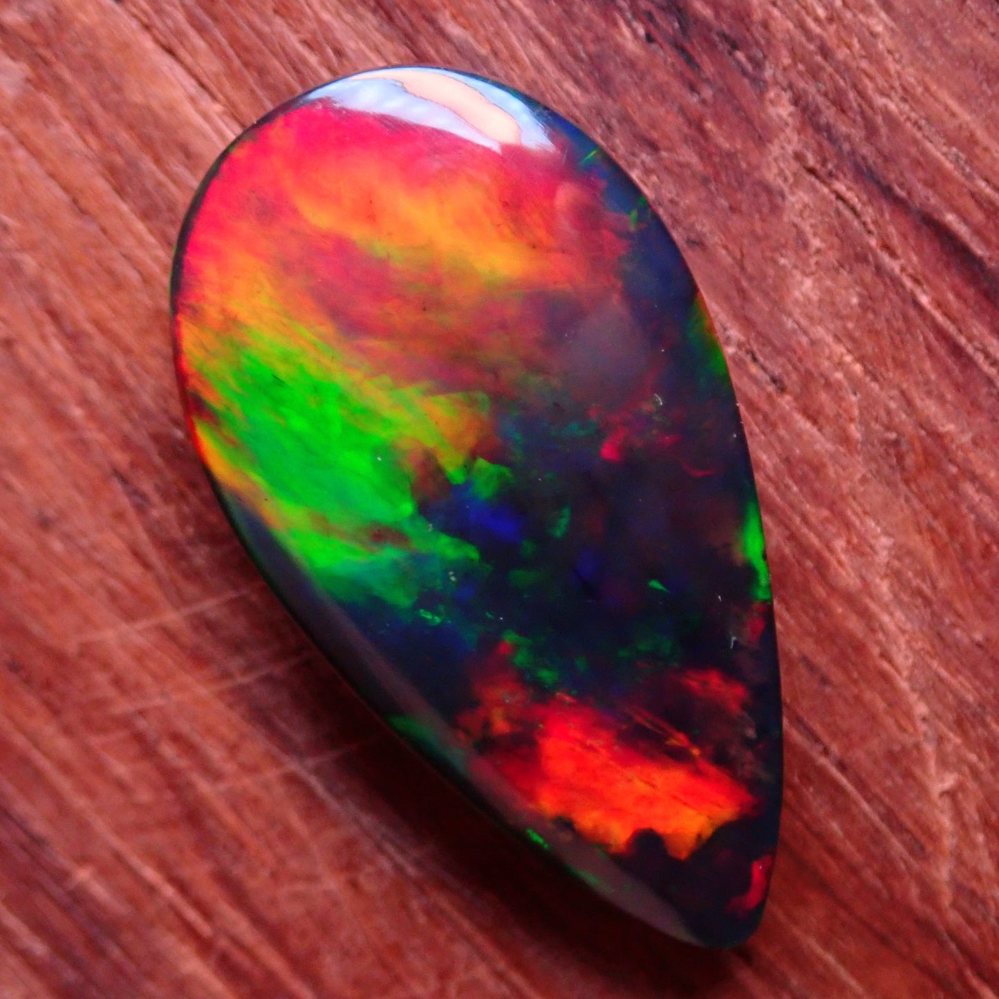 Wunderschöner Opal Cabochon (Schwarz) aus Äthiopien, 8.905 ct - 1,781g- 25,09 x 13,67 x 5,71mm