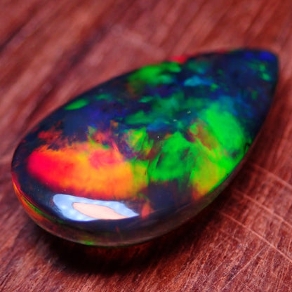 Wunderschöner Opal Cabochon (Schwarz) aus Äthiopien, 8.905 ct - 1,781g- 25,09 x 13,67 x 5,71mm