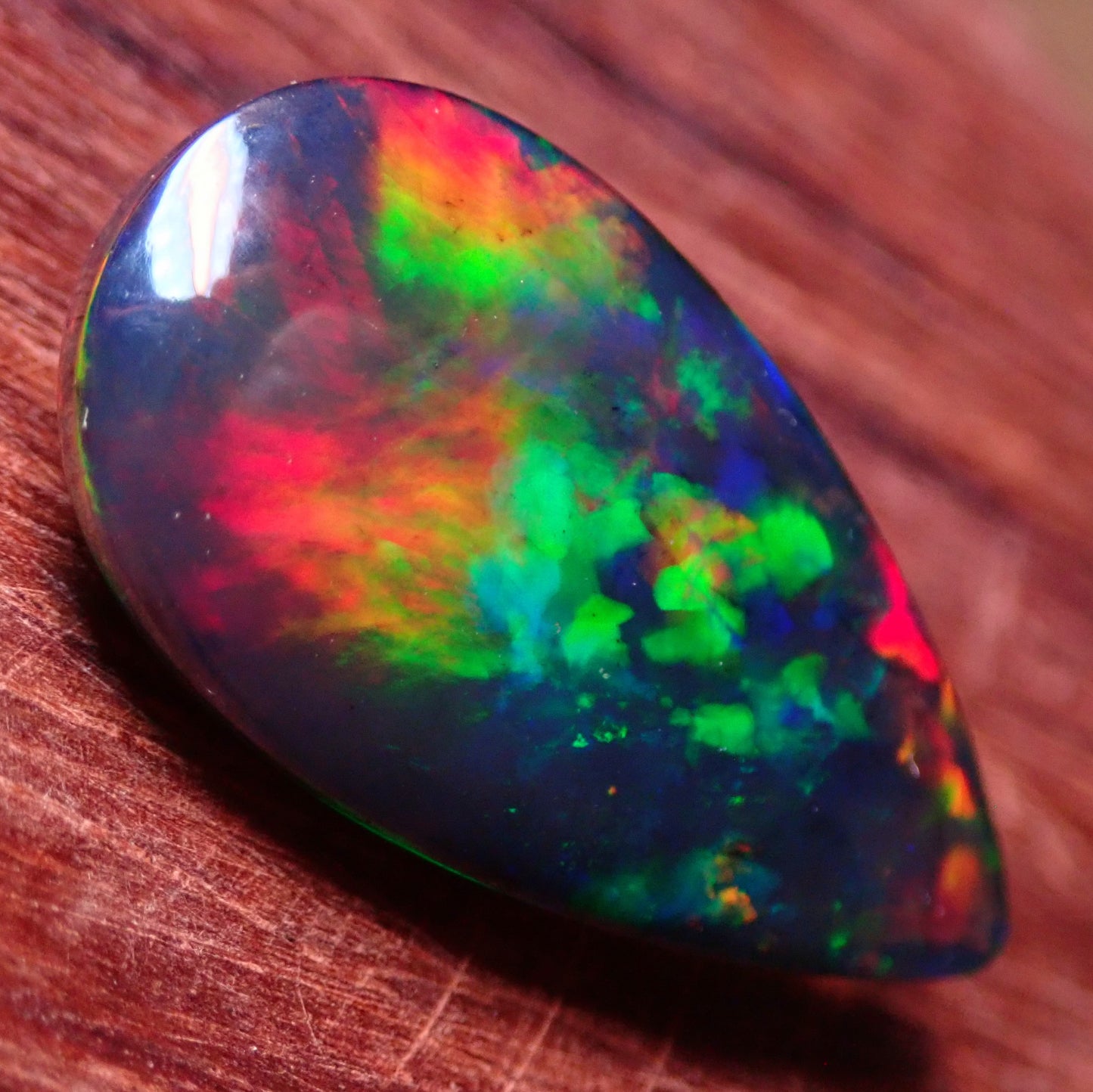 Wunderschöner Opal Cabochon (Schwarz) aus Äthiopien, 8.905 ct - 1,781g- 25,09 x 13,67 x 5,71mm