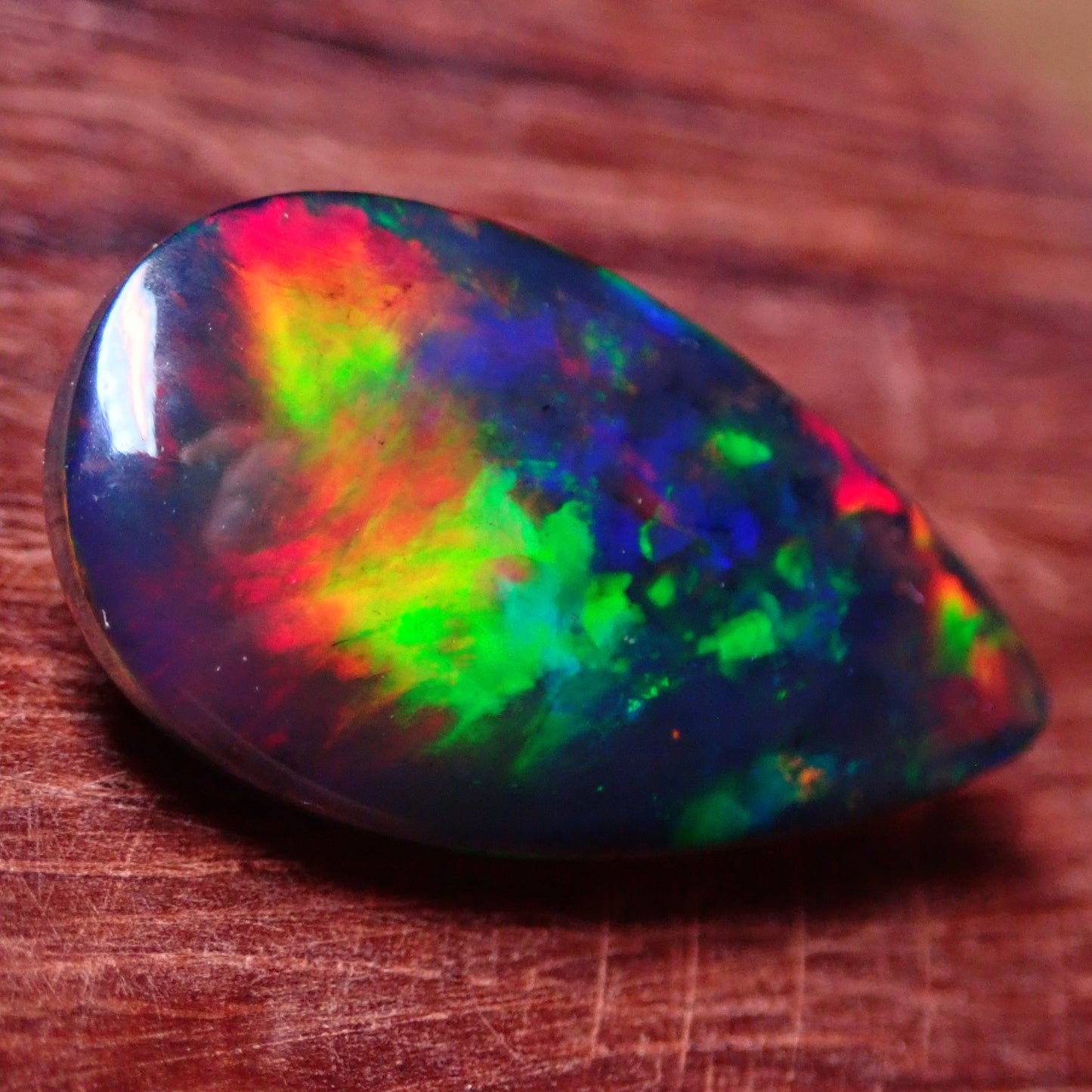 Wunderschöner Opal Cabochon (Schwarz) aus Äthiopien, 8.905 ct - 1,781g- 25,09 x 13,67 x 5,71mm